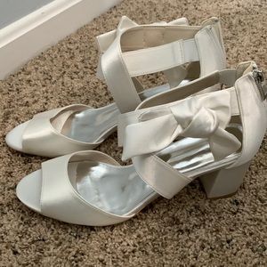 Size 8.5 JJs house white bridal shoe. Never worn. Brand new.